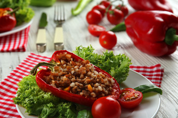 Stuffed peppers with vegetables on table close up