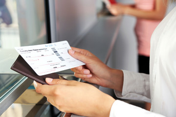 Woman buying tickets with passport at box office