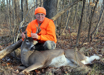 Naklejka premium Deer Hunter With a Ten Point Whitetail Buck