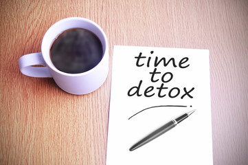 Coffee on the table with note writing time to detox