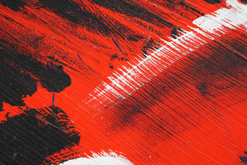 Brushstroke - white,black and red acrylic paint  on  metal surfa
