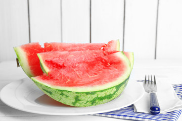 Sliced watermelon on white plate