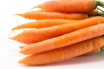 Fresh carrots on a white background