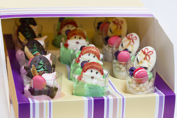 Christmas dessert canapes with cream and chocolate on a white background