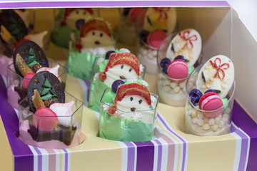 Christmas dessert canapes with cream and chocolate on a white background