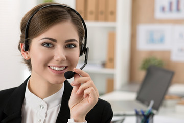 Portrait of beautiful call center operator at work