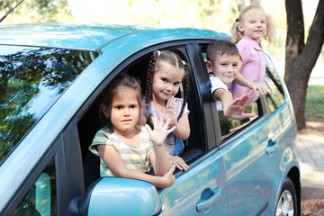 Smiling children in the car