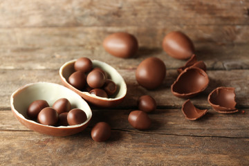 Chocolate Easter eggs on wooden background