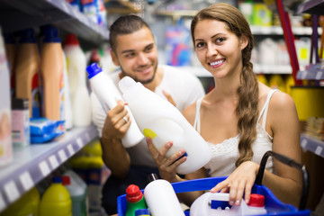 people choose some detergents in the shop