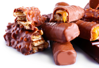 Mix of chocolate bars on table, close-up