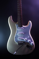 Fototapeta na wymiar Electric guitar, on dark lighted background