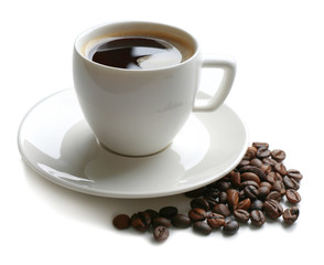 A cup of tasty drink and scattered coffee grains, isolated on white