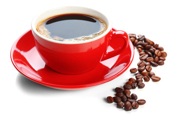 A red cup of tasty drink and scattered coffee grains, isolated on white