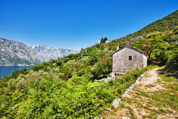 Fototapeta na wymiar The old house with view on the sea and mountains