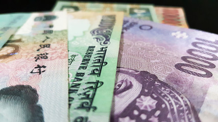 Close up of various country currency note. Soft focus and selective focus image