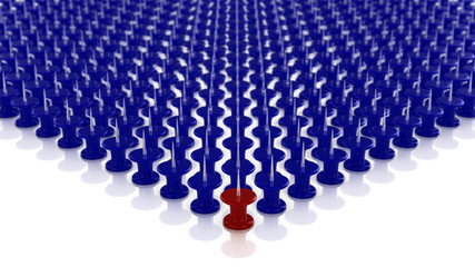 Fototapeta premium One red of many blue pins