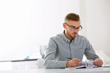 Businessman working with laptop in office