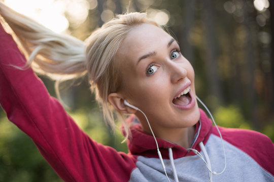 Portrait of female runner in nature after jogging