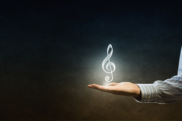 Music icon in hand
