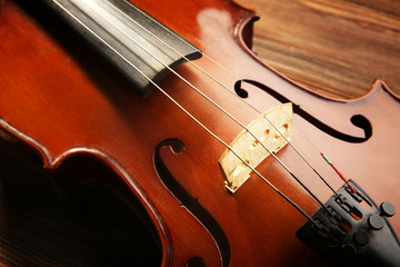 Fototapeta premium Violin on wooden background