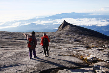 MOUNT KINABALU SABAH, BORNEO-DEC 2015: Hikers descending from Low's peak summit (4,095.2m) of Mount...