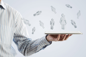 Tablet in hand with symbols