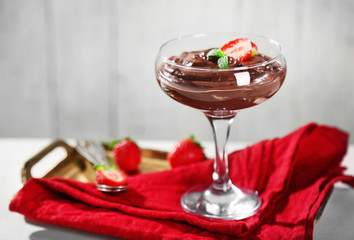 Chocolate mousse with fresh berries on wooden background
