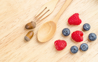 Raspberry and blueberry on wood background, Fresh fruit.