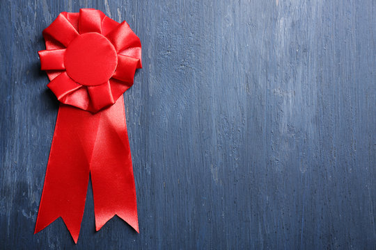 Award ribbon on wooden background