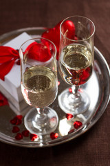 Champagne glasses, gift and  hearts