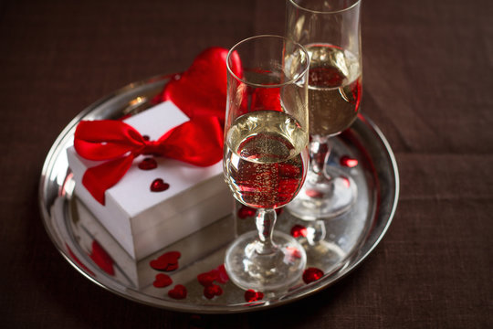 Champagne glasses, gift and  hearts