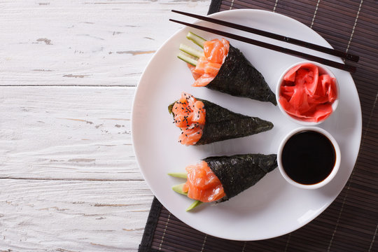 Japanese food: Salmon temaki, ginger and sauce. Horizontal top view
