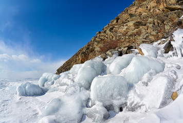 Rocks covered by ice on winter siberian Baikail lake