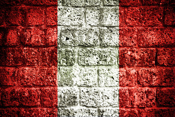 Peru flag on old brick wall