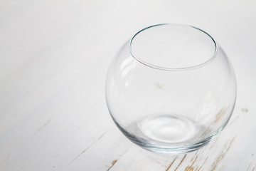 empty glass bowl on white wood background