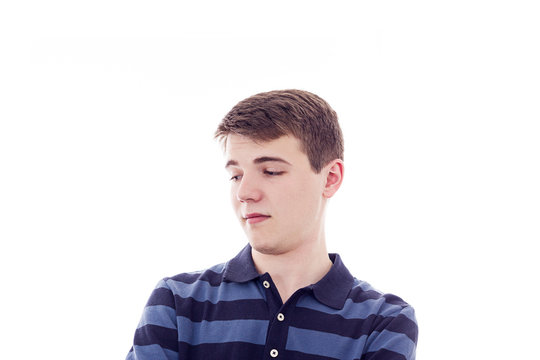  Portrait of a young student thinking looking to the right isolated on white background.