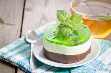 herbal tea with cake on wooden background.