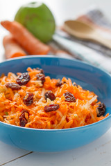 Carrot salad with raisins and apple