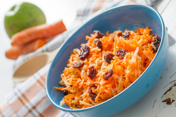Carrot salad with raisins and apple