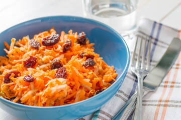 Carrot salad with raisins and apple