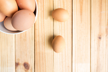 egg in bowl with wood background