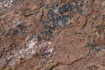 The picture shows the structure of the stone - granite.