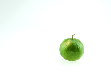 Green lemon isolated on white background