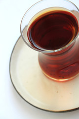 a glass of black tea