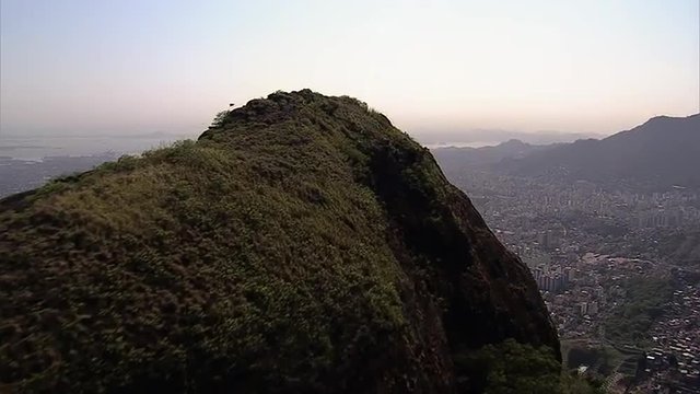 Flying above the hill to reveal the city, Rio De Janeiro, Brazil