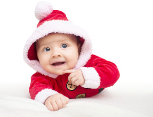 Happy baby lying on tummy wearing a red and white Christmas Santa suit.