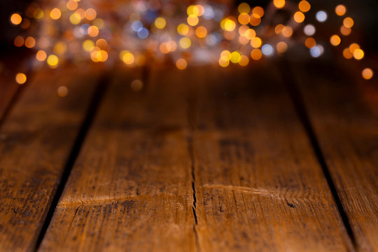 Wood background with colorful blurry lights