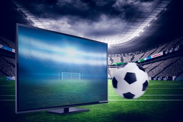 Composite image of black and white leather football