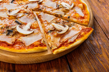 Delicious pizza with mushrooms and smoked chicken