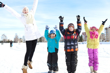 Group of happy children having fun on a winter outing